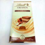 Шоколад Lindt Hasselnuss Nougat білий з горіховою нугою, 150 г.